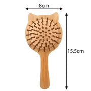 A bamboo cat-shaped hairbrush with wooden bristles, shown with dimension arrows and labels indicating a width of 8cm and a height of 15.5cm on a white background.